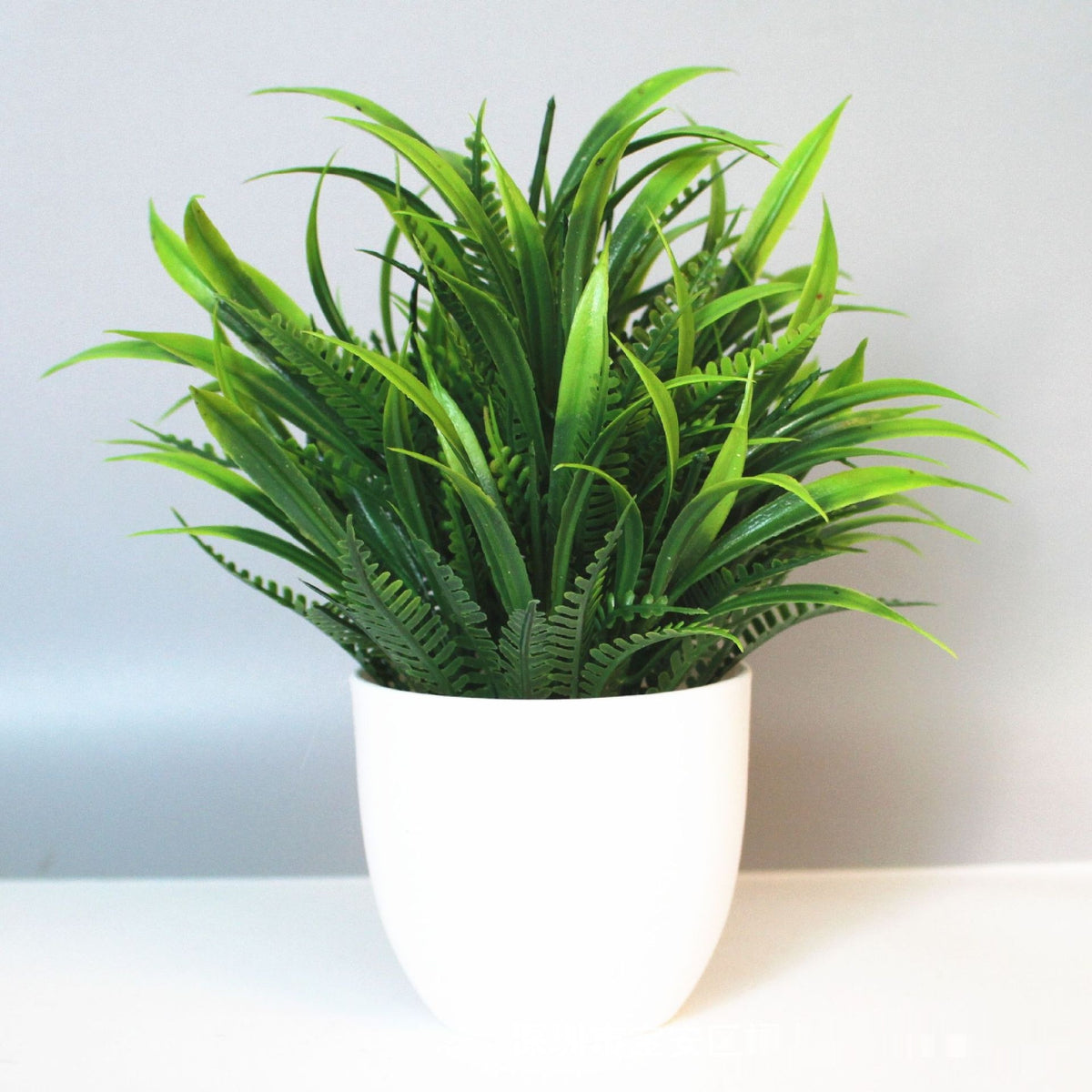 Mini Potted Faux Plant on a shelf
