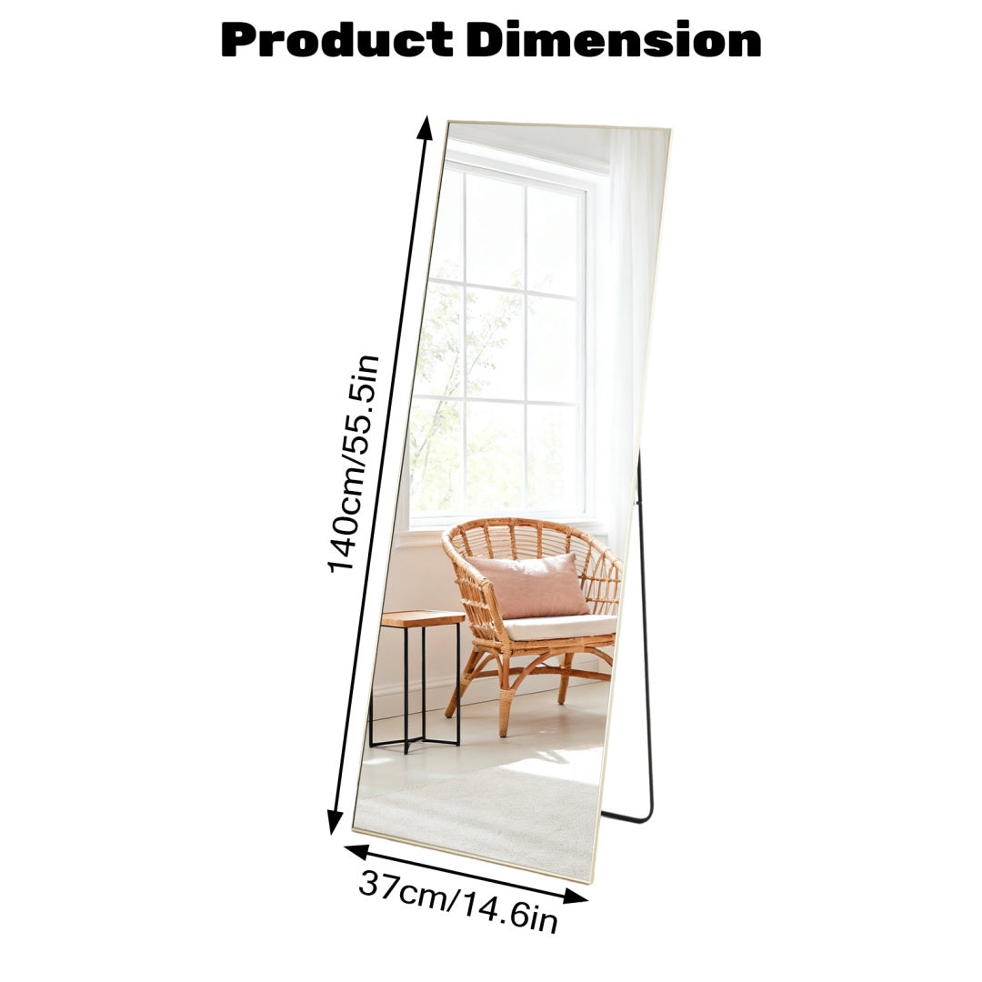 Gold Floor Mirror leaning against a wall