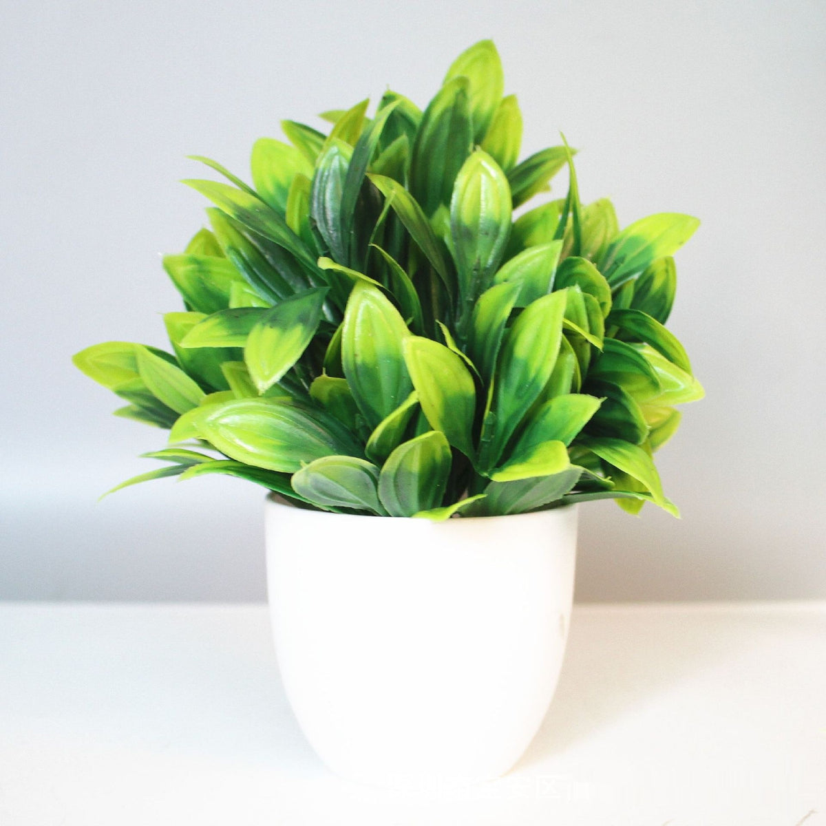 Mini Potted Faux Plant on a shelf