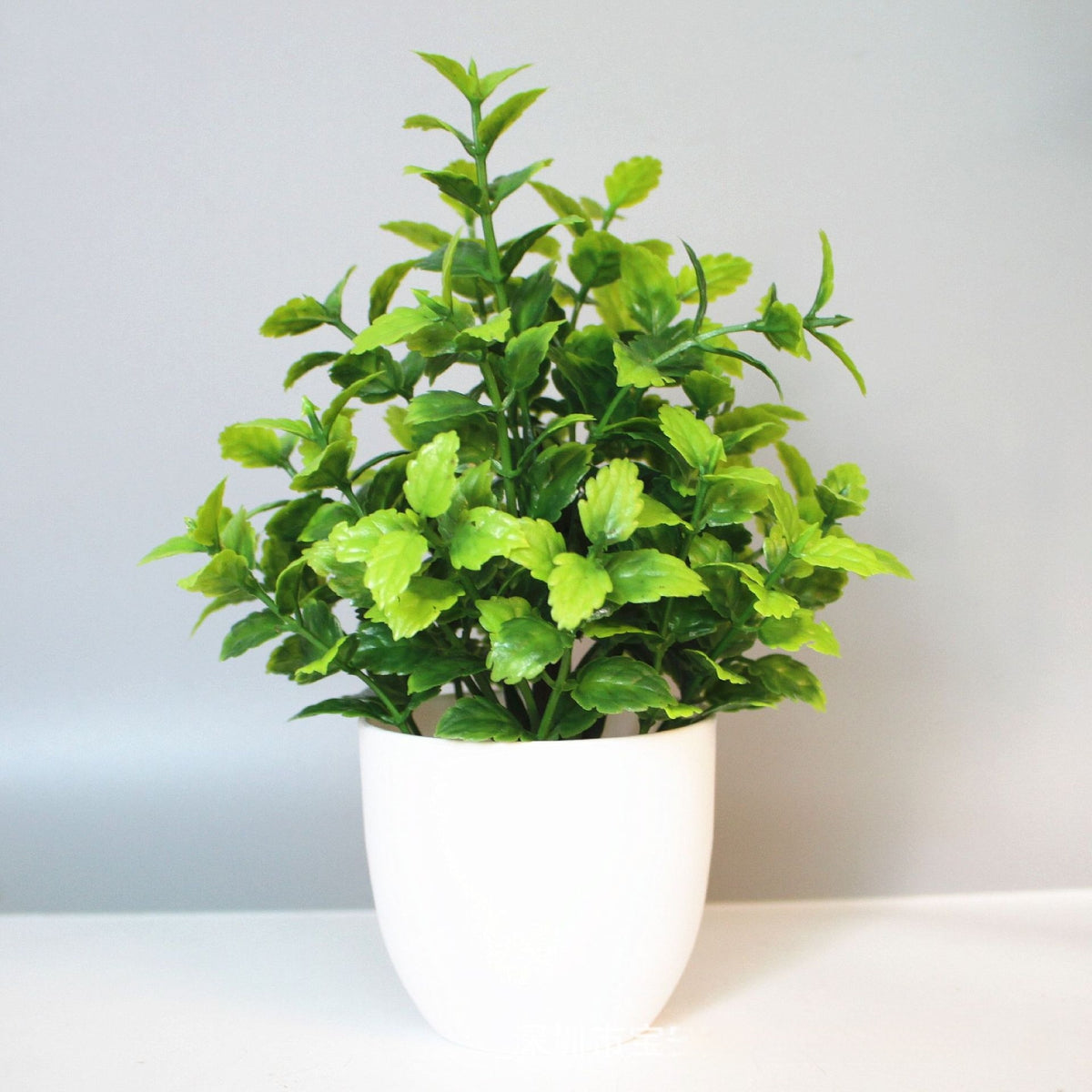Mini Potted Faux Plant on a shelf