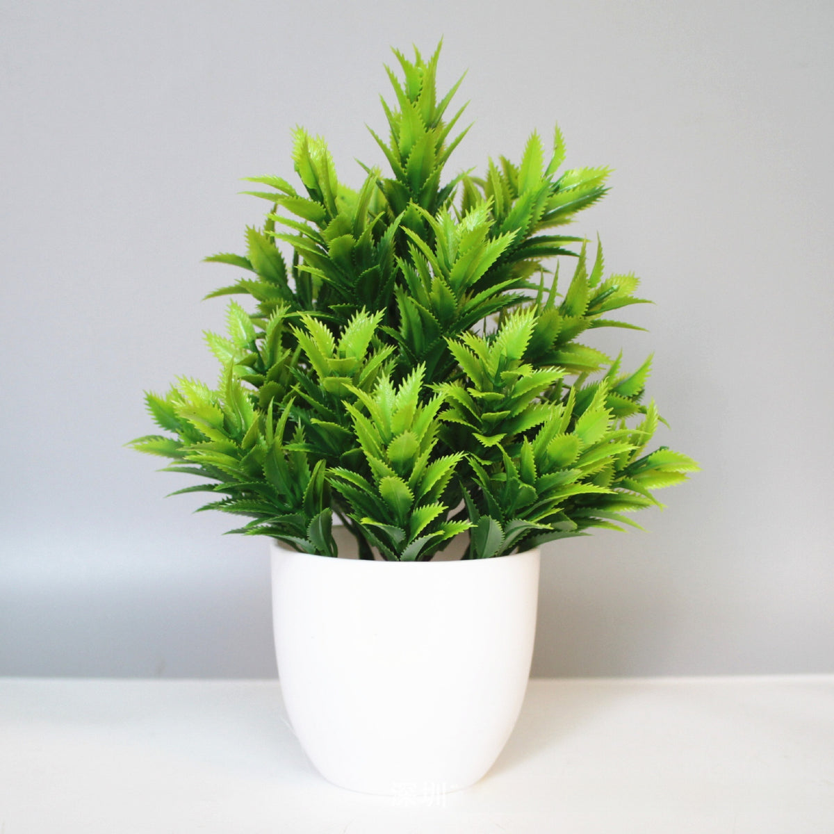 Mini Potted Faux Plant on a shelf