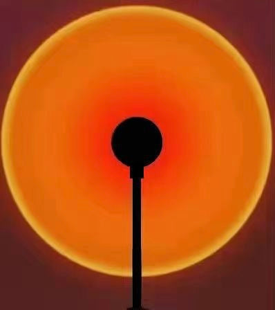 Sunset Projection Lamp casting warm amber and rose light