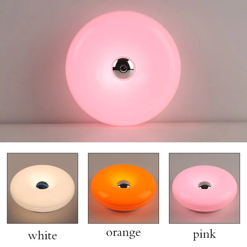 Donut Wall Lamp glowing on a wall