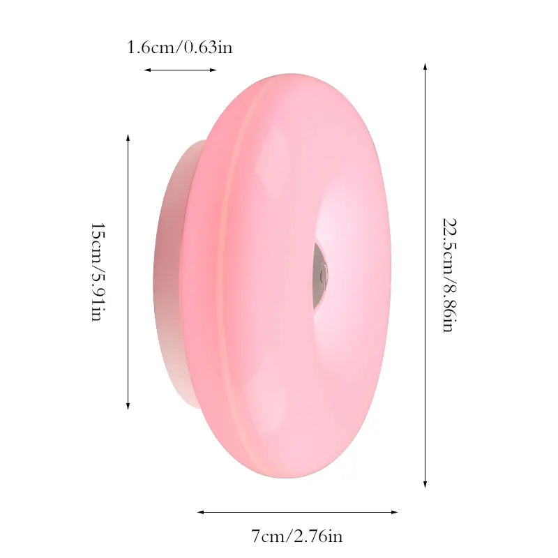 Donut Wall Lamp glowing on a wall