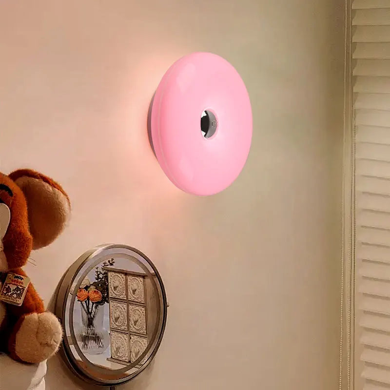 Donut Wall Lamp glowing on a wall