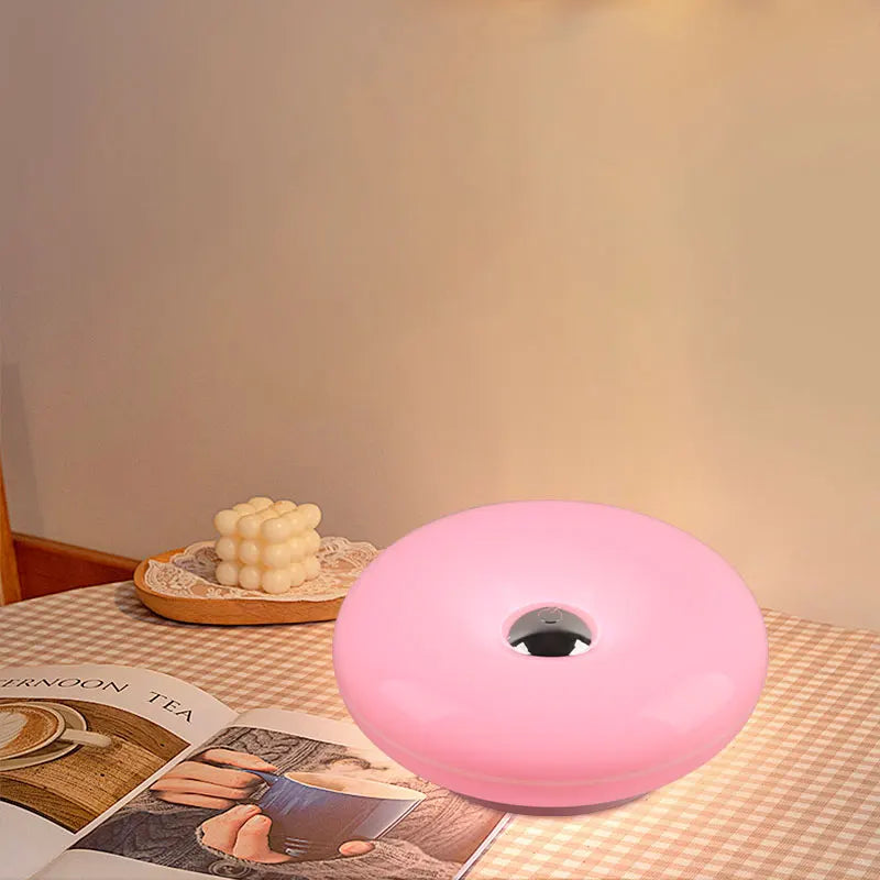 Donut Wall Lamp glowing on a wall