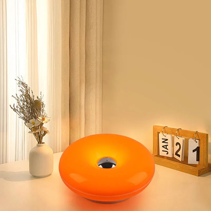 Donut Wall Lamp glowing on a wall