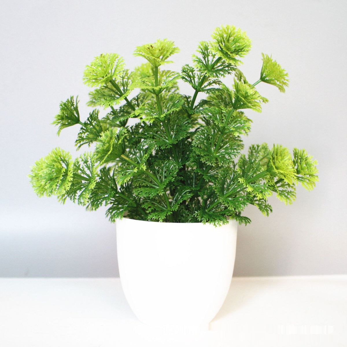 Mini Potted Faux Plant on a shelf